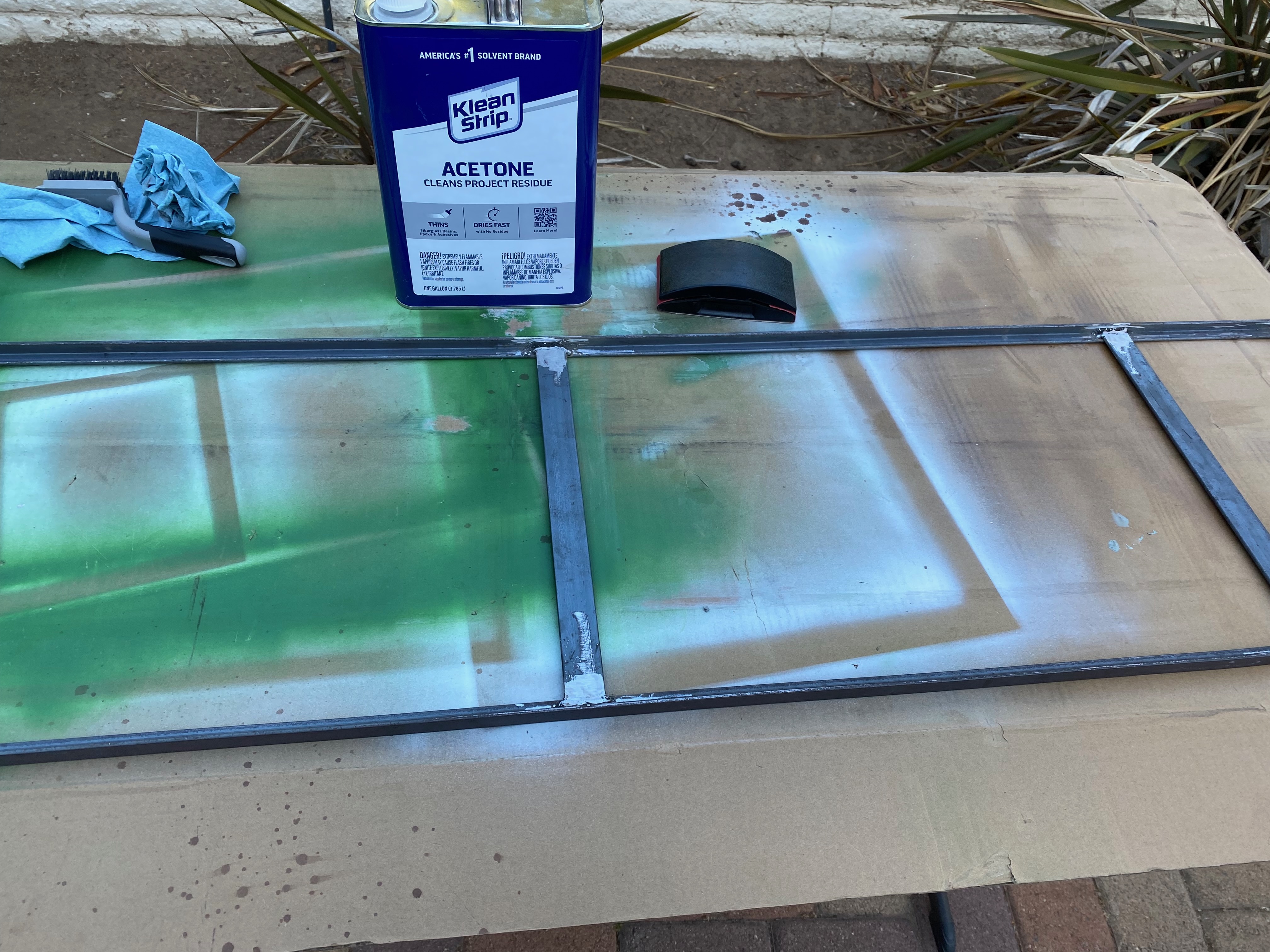 Frame interior sanded and wiped with acetone.