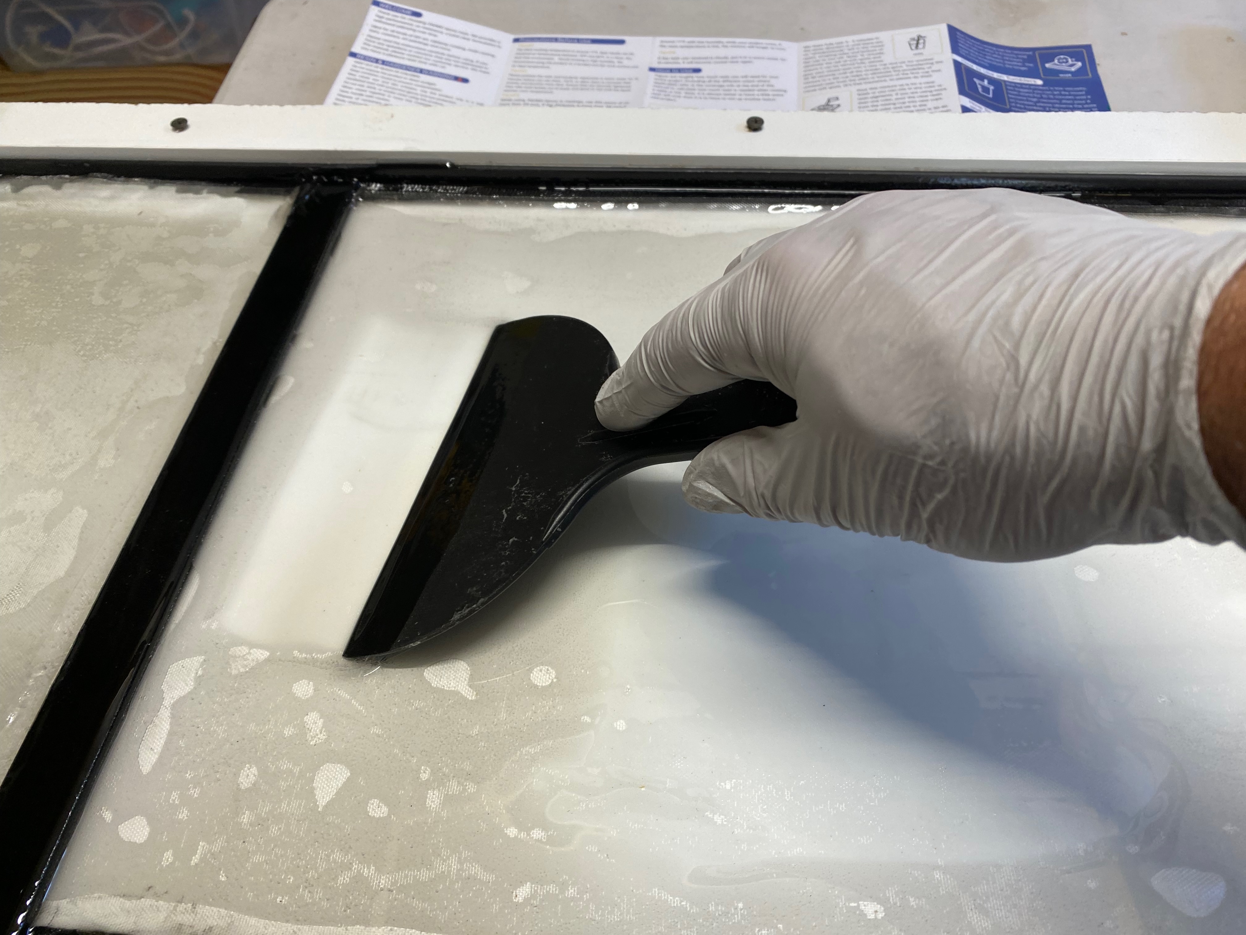 Pour resin over the fiberglass and wet it out fully.